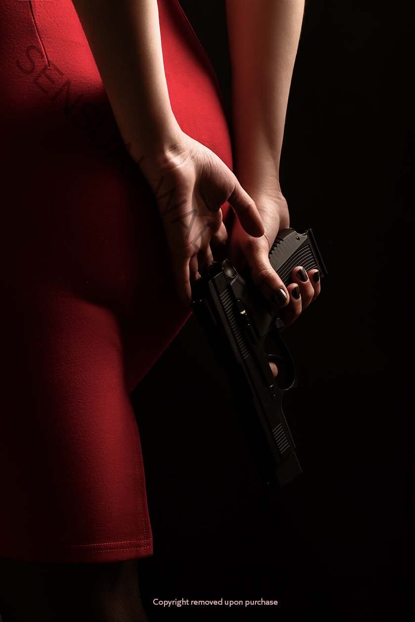woman red dress holding pistol backside view