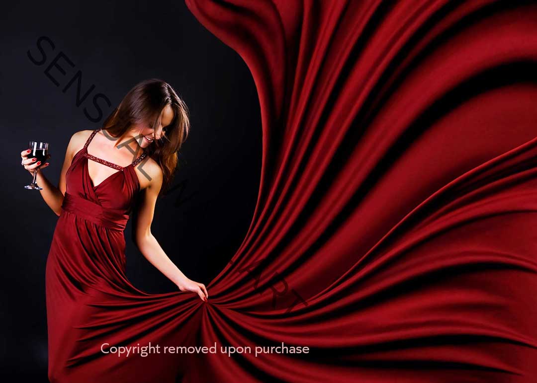 woman in red holding glass of red wine poster